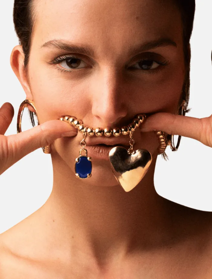 blue_diamond_charm__gold_0.webp Susmie’s Blue Diamond Charm - Gold< Necklaces