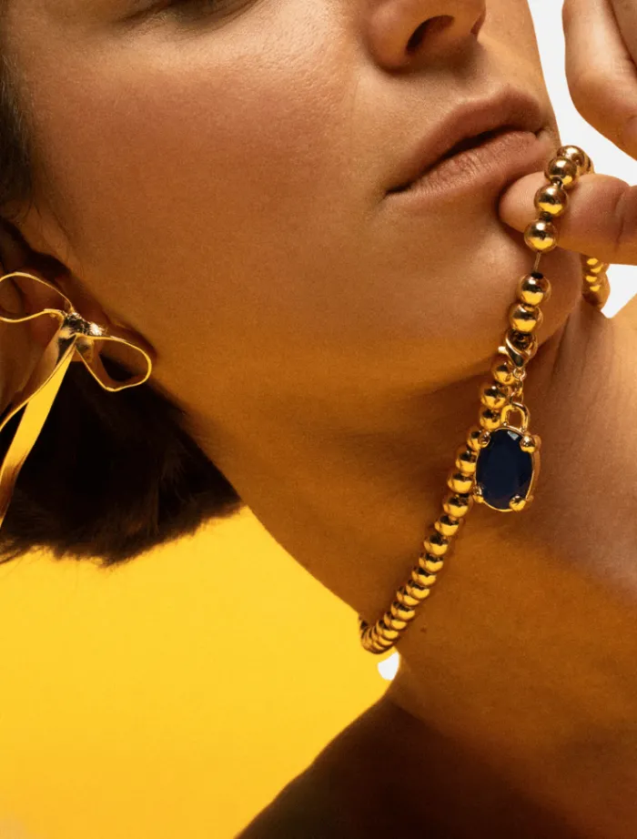 blue_diamond_charm__gold_1.webp Susmie’s Blue Diamond Charm - Gold< Necklaces