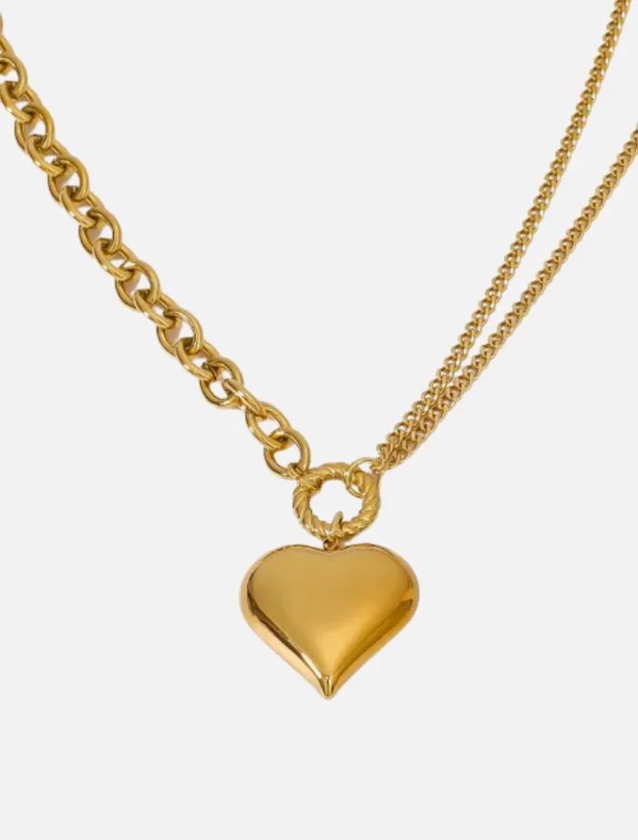 roxanne_asymmetrical_hear_0.webp Insurge Clothing Roxanne Asymmetrical Heart Necklace - Gold< Necklaces